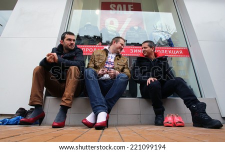 Sofia, Bulgaria - March 8, 2014: Men put on ladies shoes on high heels to support women victims of domestic and sexual violence as part of the international Walk a Mile in Her Shoes campaign.