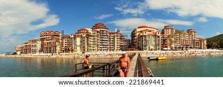 Sunny beach, Bulgaria - June 13, 2011: A man is walking on a quay at the bay of Sunny beach in Bulgaria.