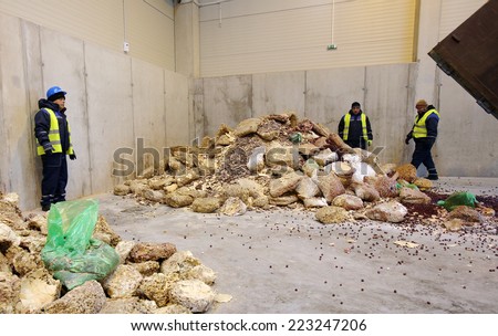 Sofia, Bulgaria - January 28, 2014: Workers are storing chopped sweets near an organic waste plant near Sofia.