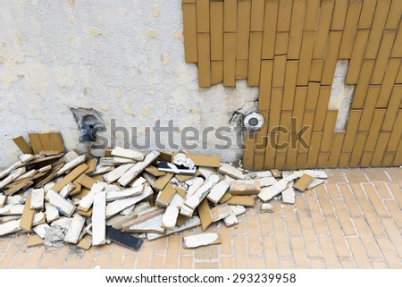 Fallen tiles of a facade of a wall of an underpass in Sofia, Bulgaria.