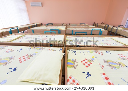 Sofia, Bulgaria - June 9, 2015: Kindergarten bedroom with small bunk beds with stairs for the kids.