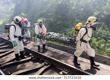 Sofia, Bulgaria - May 19, 2015: A team working with toxic acids and chemicals is saving people from a chemical cargo train crash. Teams from Fire department are participating in an emergency training.