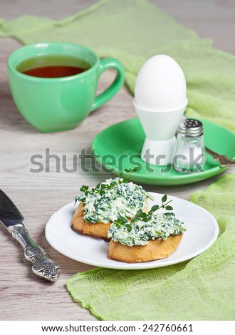 Toast with cheese and spinach, egg and coffee for breakfast