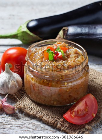 Eggplant caviar in a glass jar. Selective focus