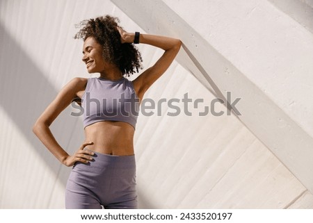 Similar – Image, Stock Photo Young athletic woman exercising at the gym.