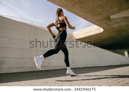 Similar – Image, Stock Photo Sporty woman running in forest