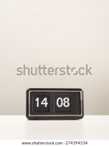 Retro flip clock sitting on white desk