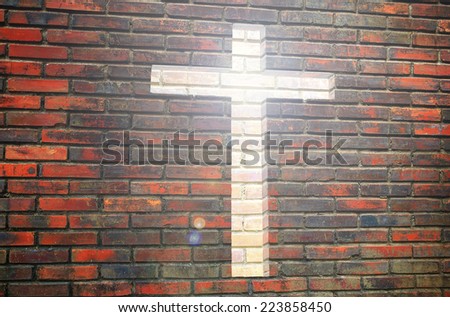 Jesus is light for way of life. Cross channel on brick wall.