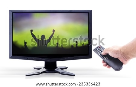 Human hands holding remote and monitor display Silhouettes soccer fans club raising hands over stadium on white background.