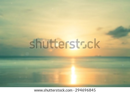 Vintage style. Abstract blurred textured background: orange and green patterns. Blurred nature background. Moon in clouds over yellow sea sunset blurred background.
