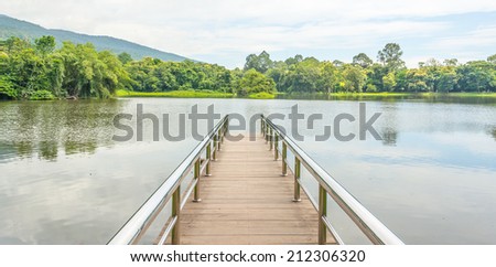 stainless steel bridge or pier at lake constance see the mountain