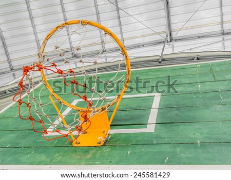 old green basketball board with hoop on white steel bar background