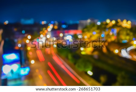 blur image of street and bokeh in night time for background usage.