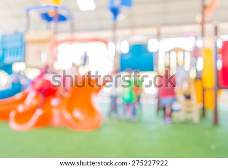 Defocused and blur image of children\'s playground at public park for background usage.