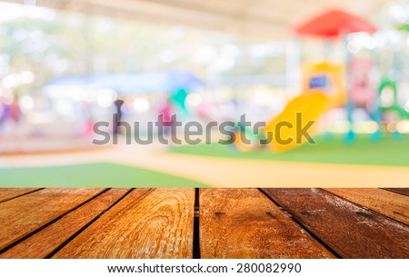 Defocused and blur image of children\'s playground at public park for background usage.
