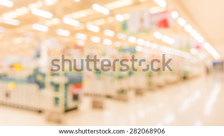blurred image of shopping mall with no people for background usage .