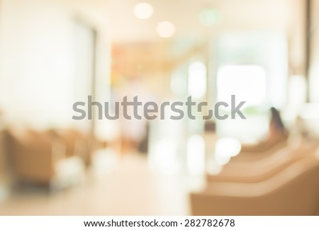 blur image of hospital office room with table and chairs for background usage.