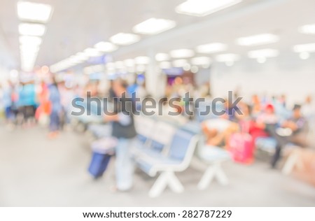 Blurred waiting chairs zone in airport,use as background.
