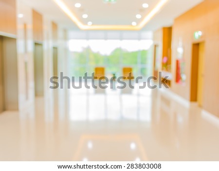blur image of hospital office room with table and chairs for background usage.
