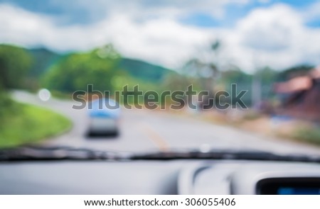 blur image of inside cars to see the road  with bokeh lights for background usage.