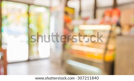 image of blur bakery shop with bokeh for background usage .