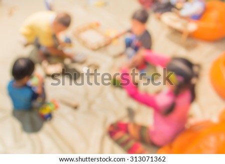 blur image of  child play toy set on floor for background usage .