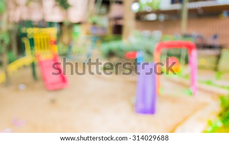 Defocused and blur image of children's playground at public park for background usage.