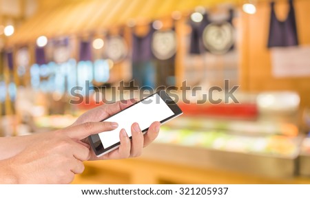 blur image of Abstract blurry sushi counter in vintage style decoration restaurant.