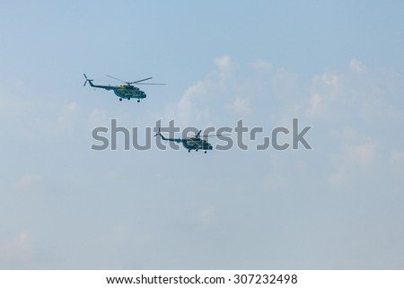 Crimea - 26 July 2015: parade in honor of the Day Russian Navy in Sevastopol. Flight MI-8 helicopter over the bay of the city