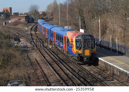 Staines, UK - February 21: Uproar over above inflation price rises on Britains Railway system. Here a South West Trains unit approaching Staines, UK on February 21, 2009