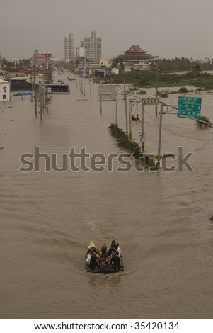 LINBIAN, TAIWAN - AUGUST 11 : Aerial view of inflatable boat rescues villagers at Route 17 caused by Typhoon Morakot August 11, 2009 in Linbian, Taiwan.