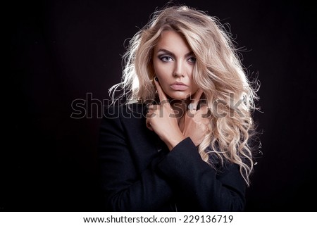 girl in black with blond hair