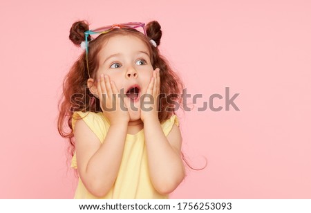 Similar – Image, Stock Photo Cute caucasian little girl with Strelitzia houseplant at home. Greenery in modern apartment. Love and take care of plants, hobby time. Indoor cozy garden.