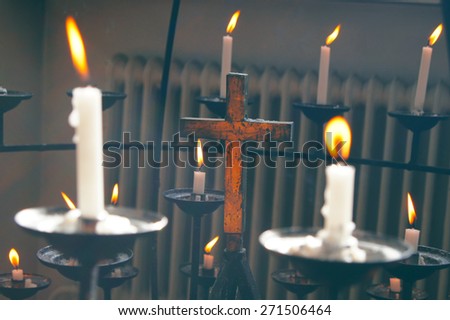 Cross and candles in the Helsinki Cathedral in Helsinki, Finland