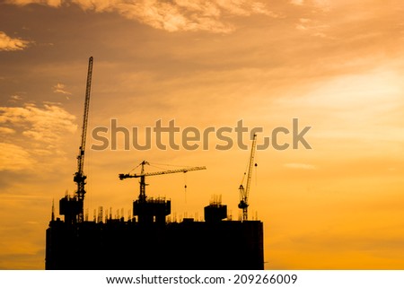 silhouette Building construction and warm sky