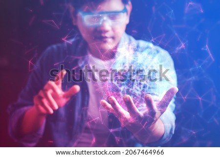 The metaverse universe, Man wearing augmented reality on virtual screen future technology, The real world with the virtual world overlapped, transformed into the virtual world.