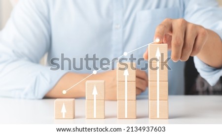 Interest rate and dividend concept, wooden block with percentage symbol and up arrow, return on stocks and mutual funds, long term investment for retirement. Foto d'archivio © 