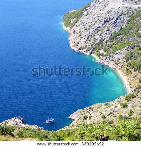 BirdÃ¢Â?Â?s Eye View of Blue Bay with Boat in the Distance