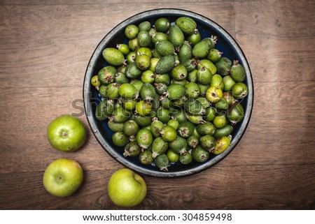 apple feijoa health vitamin green sweet sour on the wooden background selective soft focus