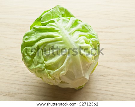 Heart of butter lettuce on wooden board