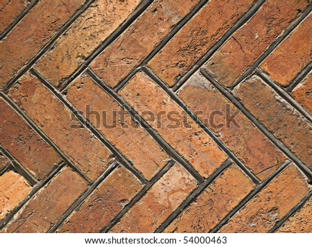 Vintage stone tiles in herringbone pattern