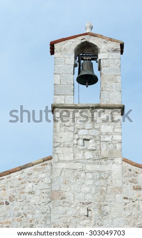 Small bell tower with a bell of a country church in the 13th century