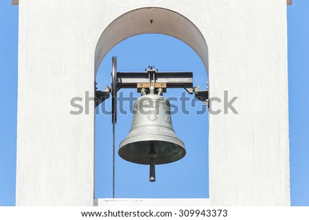 Small bell tower with a bell of a country church i