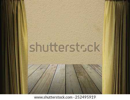 gold curtains on pink wall texture background with wooden paving.