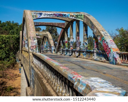 Similar – Image, Stock Photo Graffiti on a bridge: “Stop consuming”. Seen in Berlin / Photo: Alexander Hauk