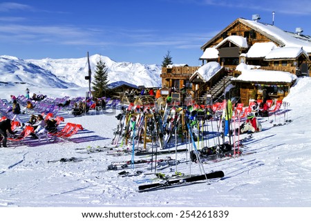 Val Thorens, Alps, France, February 09 2015: People are relaxing at a chalet bar after skiing and snowboarding in in the 3 Valleys Ski Resort