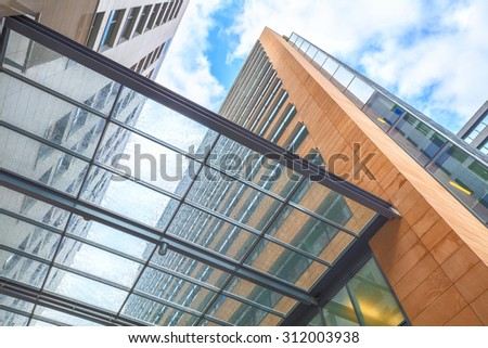 Antwerp, Belgium - August 14, 2015: Perspective view from below through transparent wet canopy of modern building