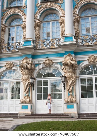 A tourist on the steps of the Great Catherine Palace. Tsarskoye Selo. Russia