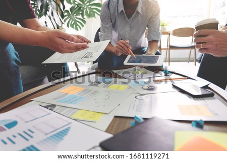 Business people writing on sticky notes for colleagues thinking strategy business plan or over problem in coworking office, Diverse Brainstorm Business Meeting Concept