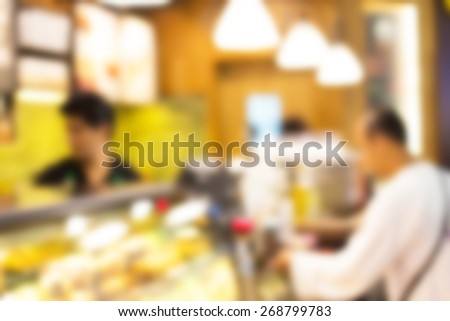 Blurred background : Vintage filter ,Barista at Coffee shop counter service blur background with bokeh.
